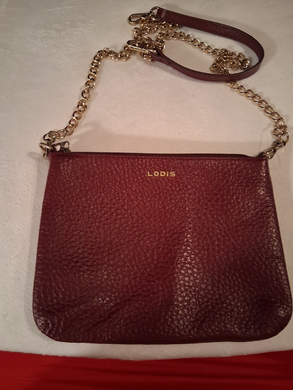 Lodis Pebbled Leather Crossbody in Wine with Gold Chain Strap